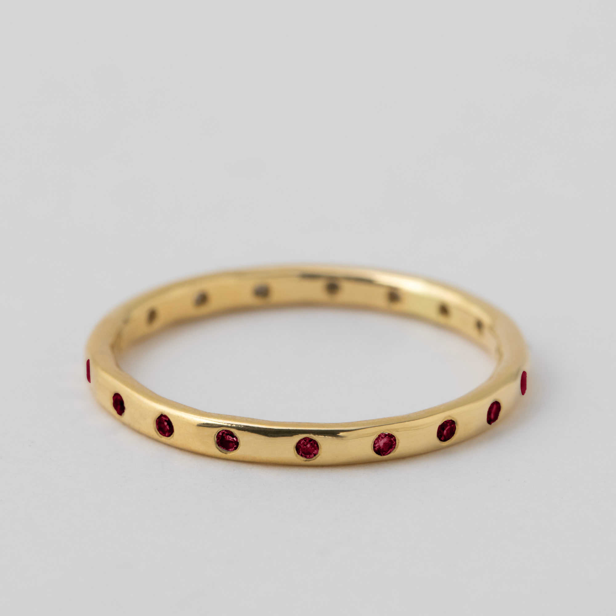 18 Ruby Band - 18k Yellow Gold metal: 18YG setting: Flush Set Bands stone: Ruby style: 18 Stone Band width: 1.5mm HIDDEN 5a132cdca9382cb16d3ab955883165ae66f171ca092224500b61e644f34c04ab