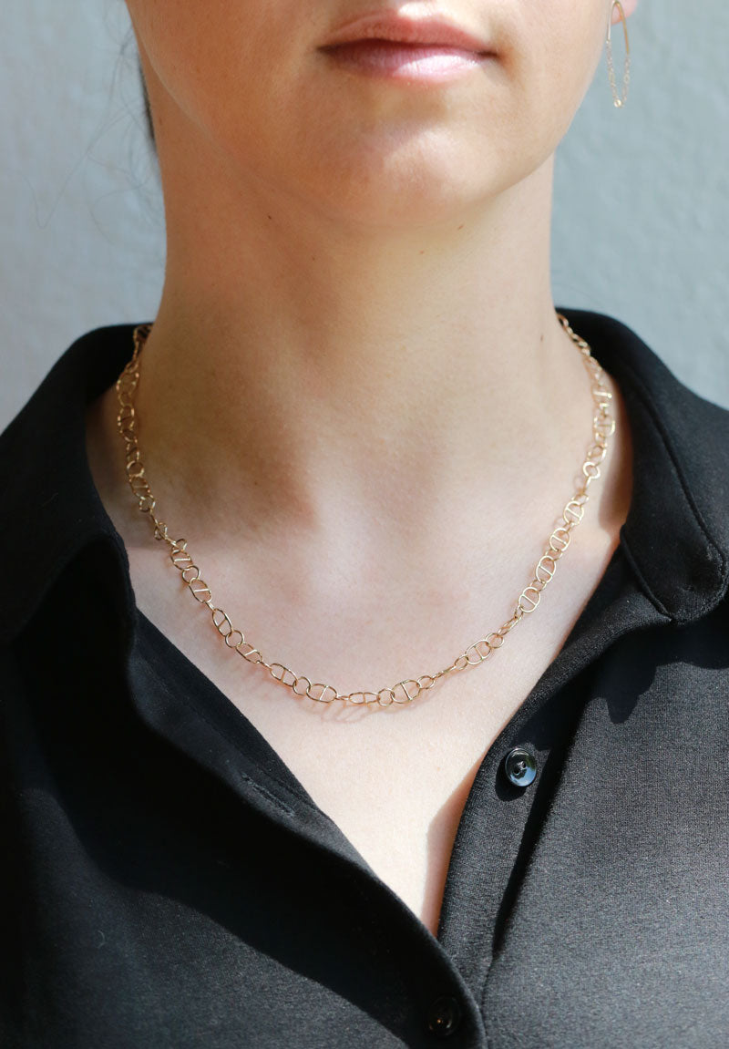 Oval cross bar chain necklace